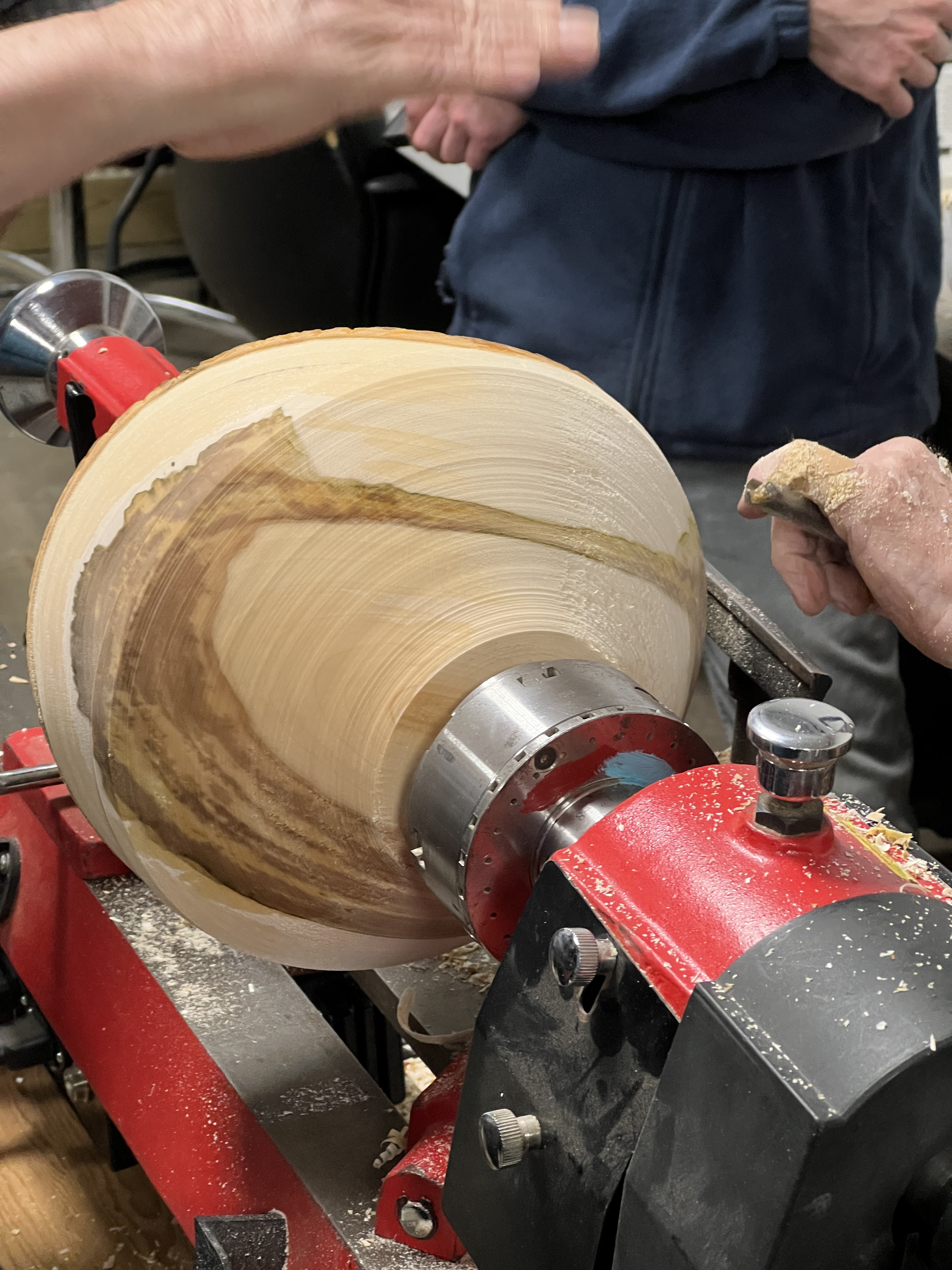 Live edge wood bowl being turned on a lathe